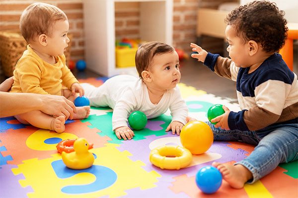 Infants learning through sensory play at Kinder Grove in Toronto