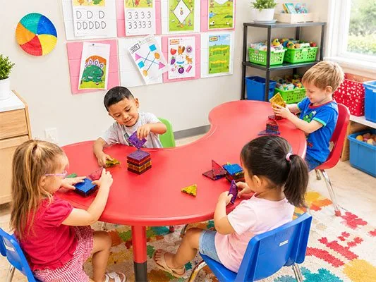 Preschool children developing school-readiness skills through play at Kinder Grove